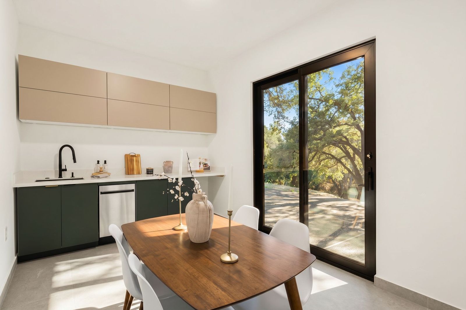 ADU kitchenette with dining nook and slider to the outdoors