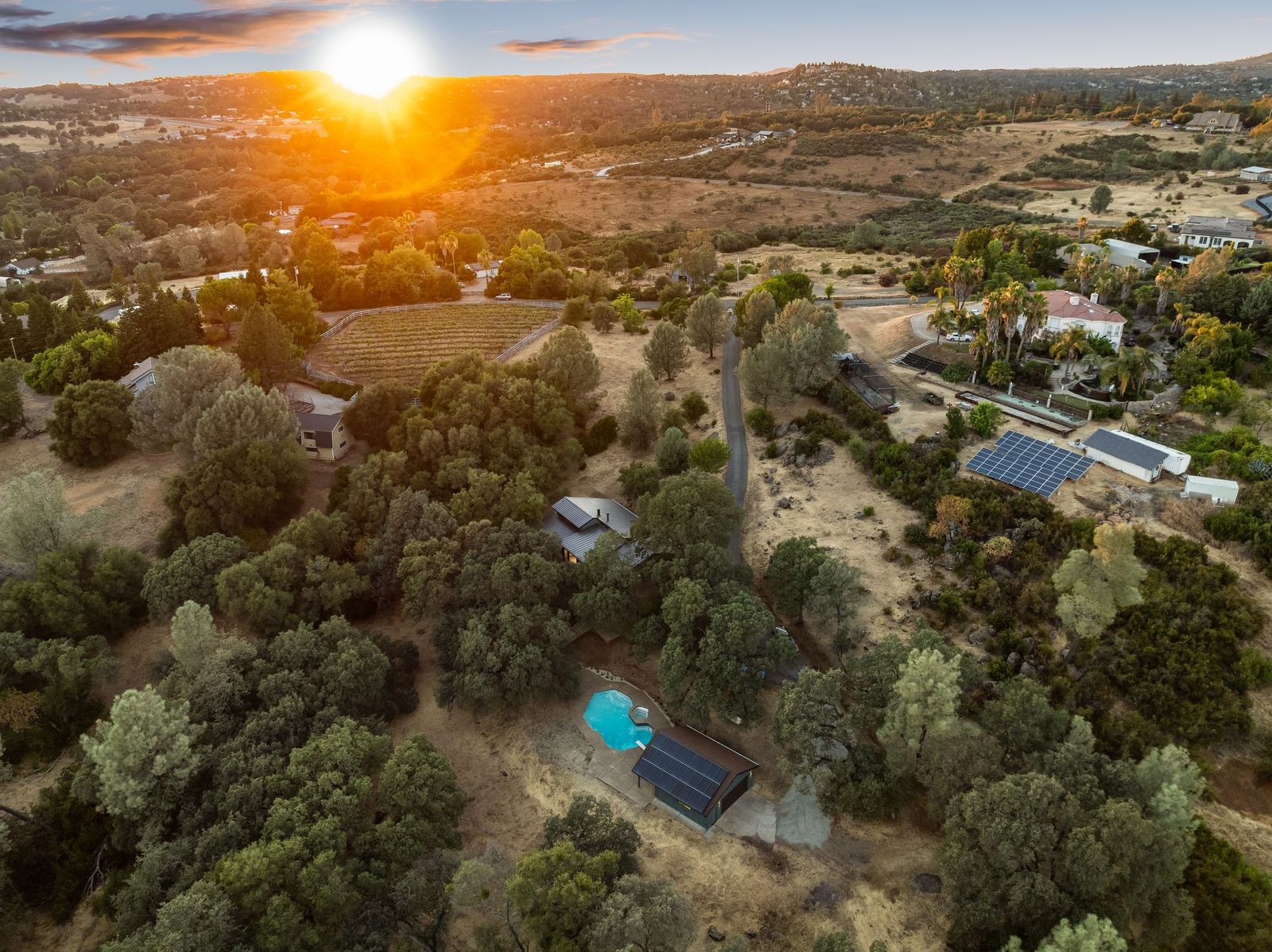 Aerial drone view of the 5-acre property at sunset