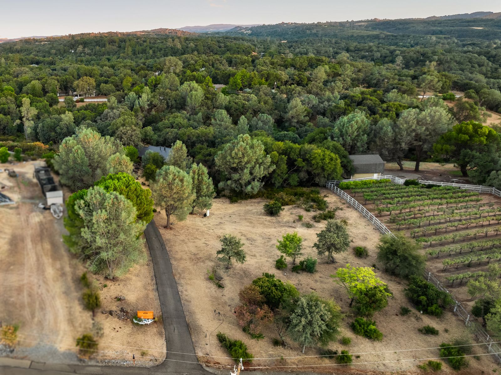 Aerial view of the property showing neighboring vineyard